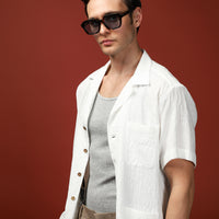 Off-white short-sleeved oversized cotton patterned shirt