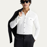 Off-white long-sleeved slim-fit cotton sports shirt.